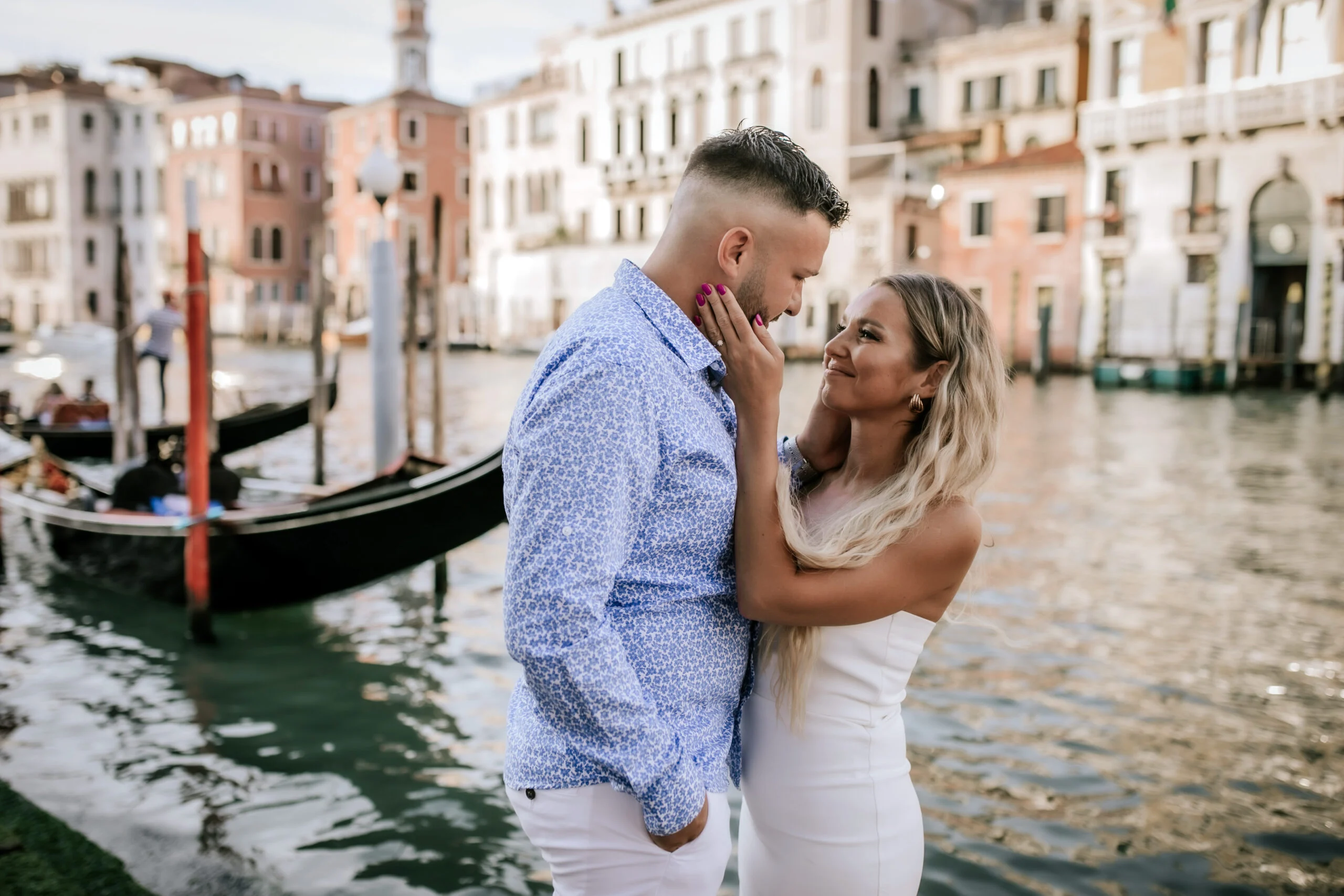 Couple face to face beside the canal