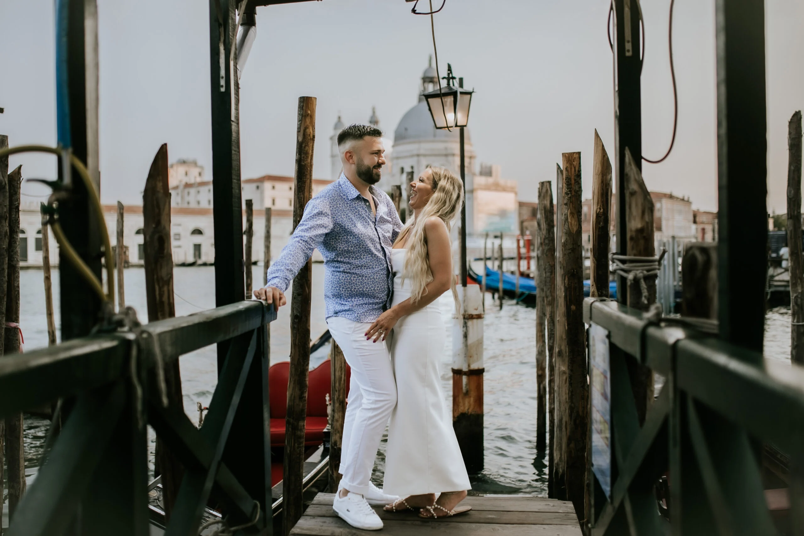 Couple walking along the quay hand in hand