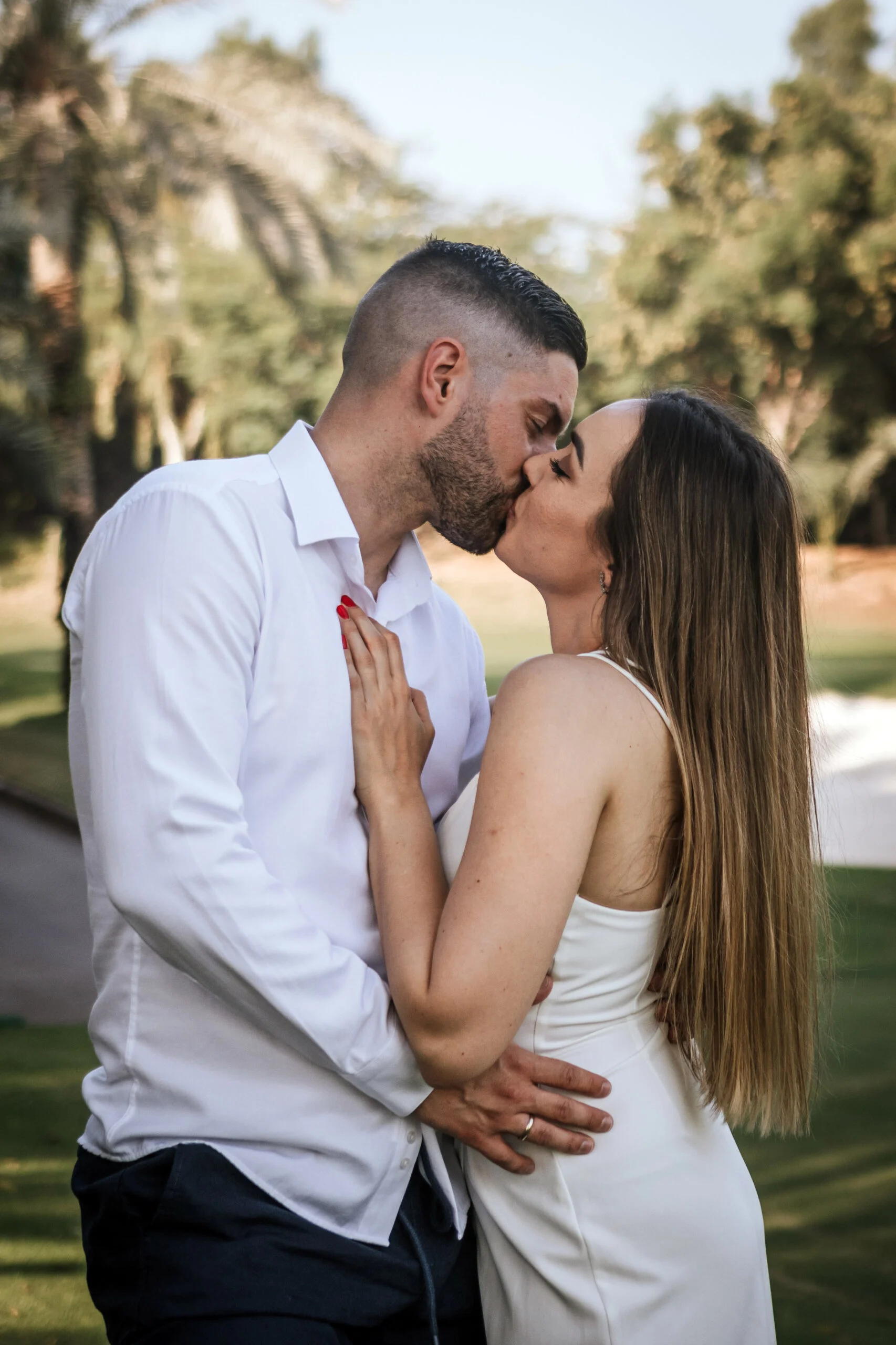 Close frame of the couple embracing outdoors
