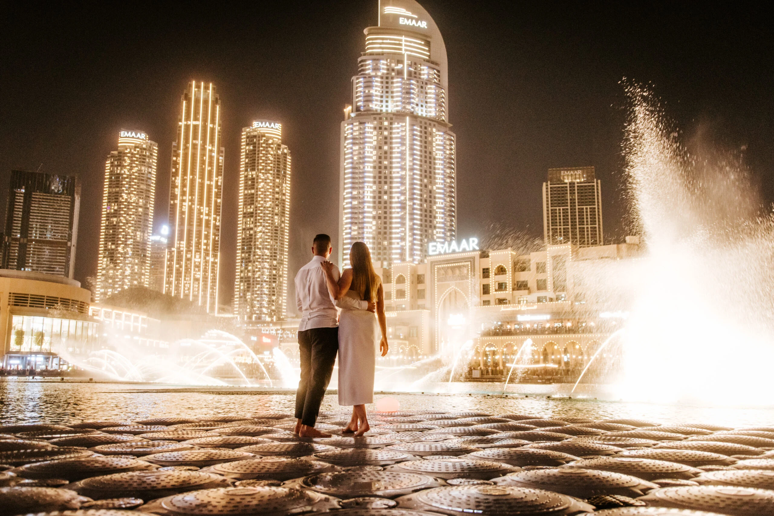 Couple watching the fountains at night