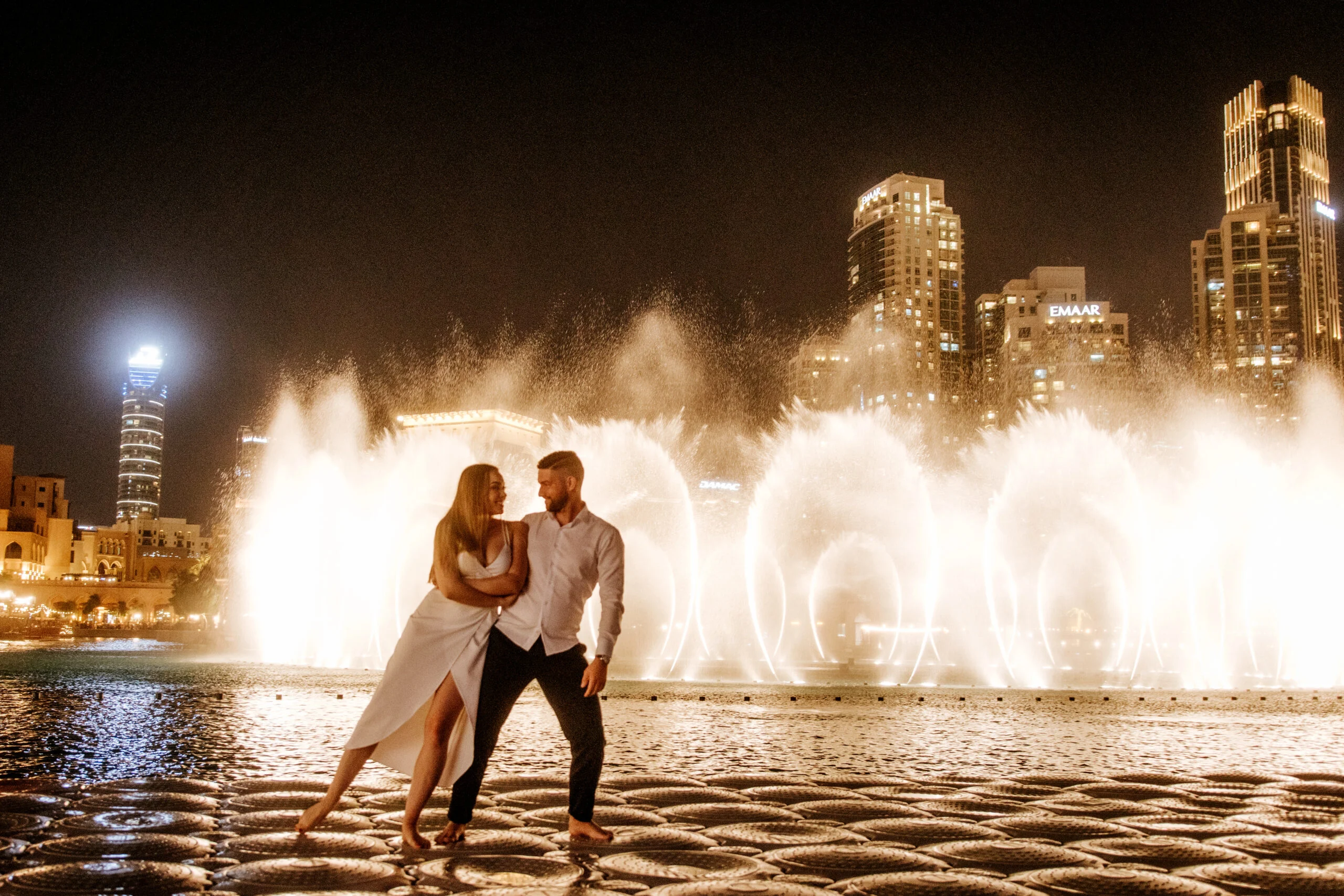 Couple dancing in front of the fountains