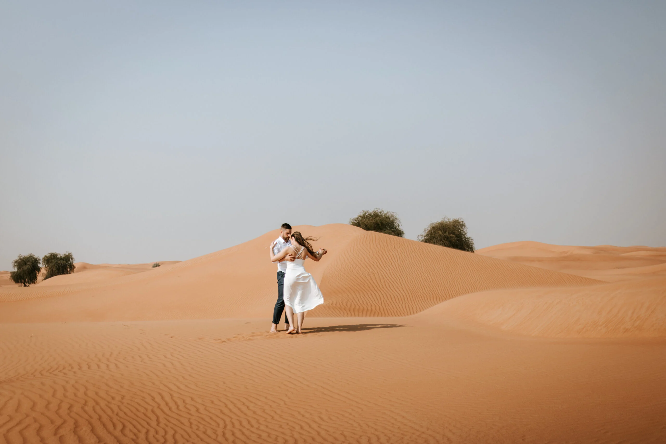 Couple dancing on the sand