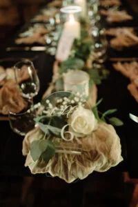Detail of roses and candles on the dinner table
