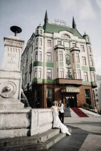 Bride and groom on the steps of Hotel Moskva in the centre of Belgrade