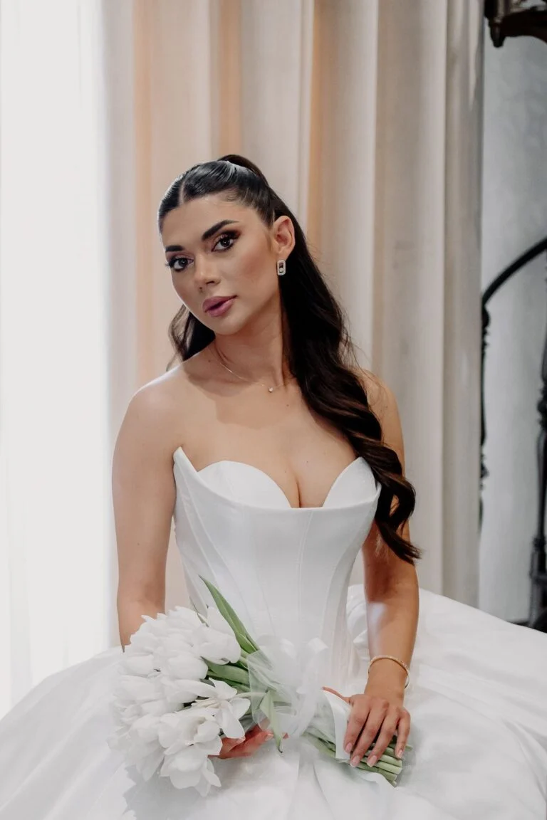 Portrait of the bride holding white tulips