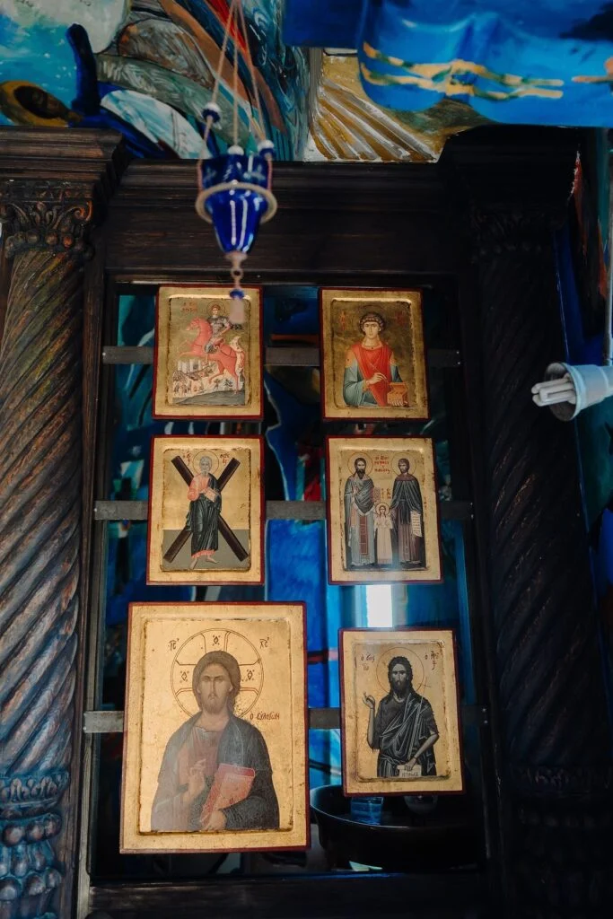 Orthodox icons in a carved wooden screen inside a church