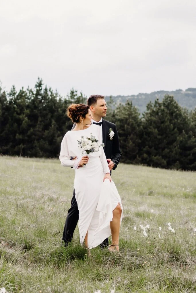 Bride and groom in a meadow of wild narcissus on Divčibare