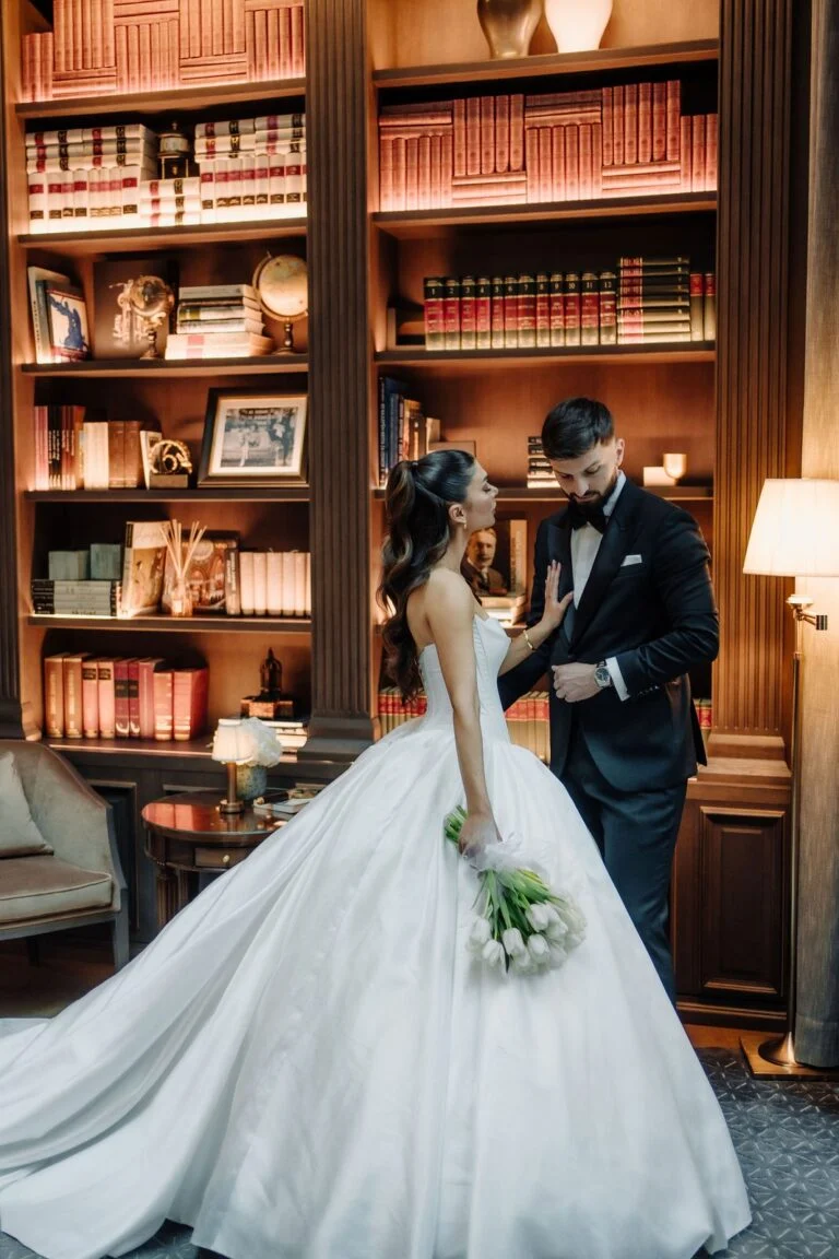 Bride and groom in the wood panelled library at Hotel Bristol in Belgrade