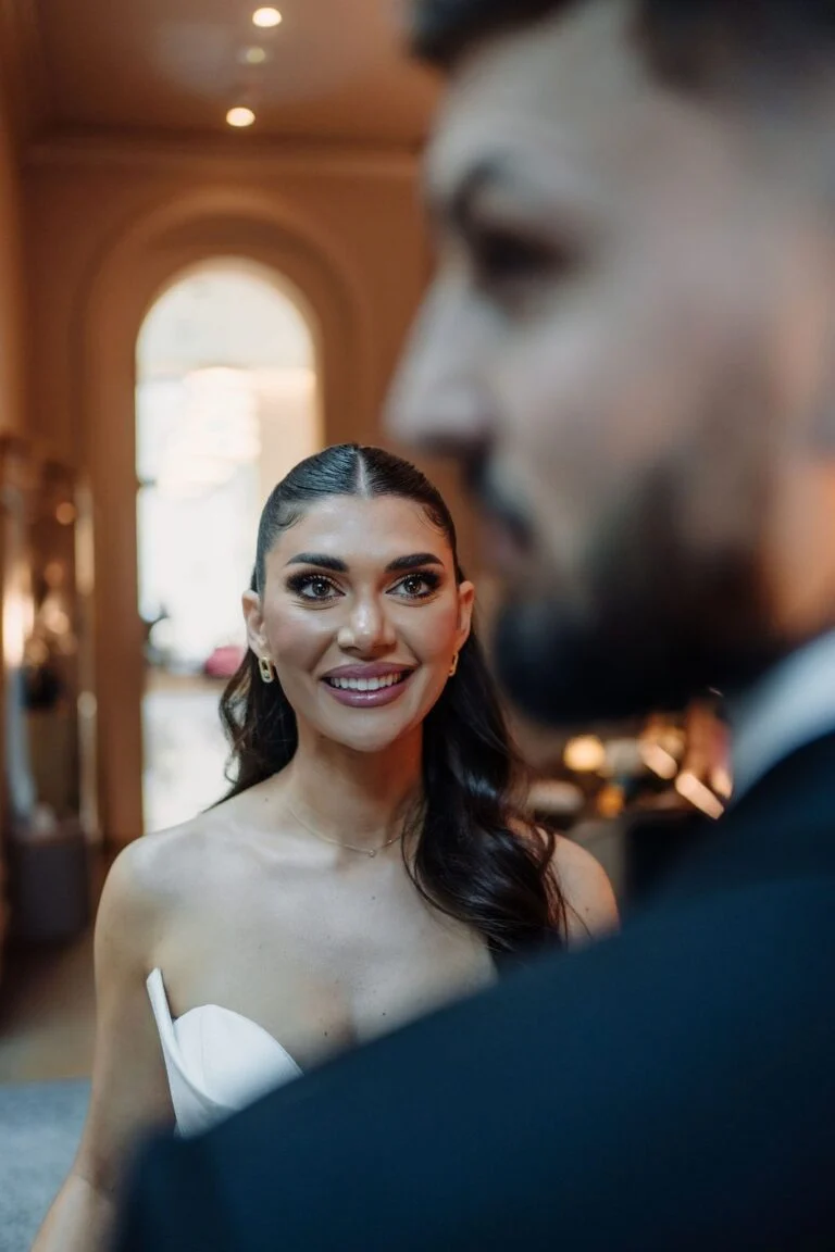 Close portrait of the bride at Hotel Bristol, the groom out of focus in the foreground