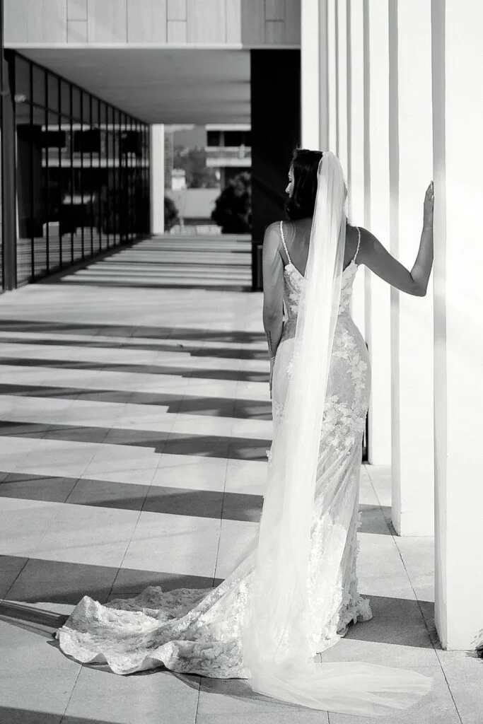 Black and white photograph of the bride's train across the steps